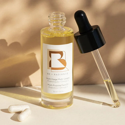 Be + Radiance Multi-Purpose Face Oil 1oz bottle stylized with dropper