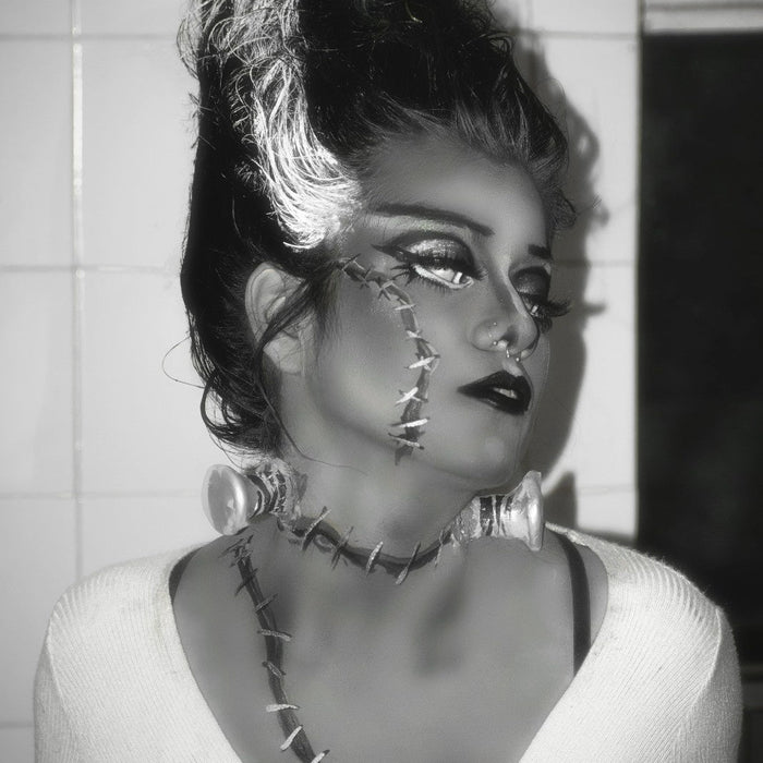 A woman dressed as the Bride of Frankenstein for Halloween