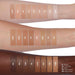 Anastasia Beverly Hills Impeccable Blurring Second-Skin Matte Foundation swatch chart on arms. Shade number on respected swatch. Key legend for what each letter represents in bottom right corner.