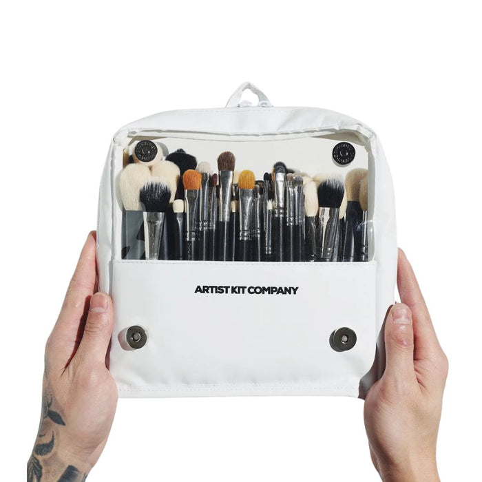 Artist Kit Company Brush Bag Large held up with two hands by the sides.