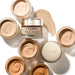 By Terry Eclat Opulent Serum Foundation jars stylized open and closed with one swatch