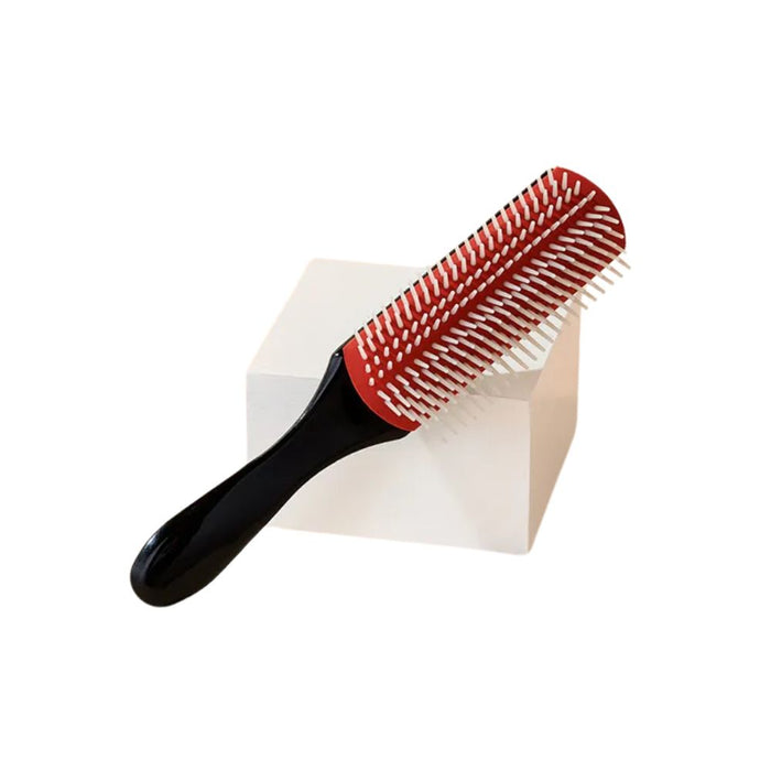 Diane Pro Nylon Pin Styling Brush leaned against small white block