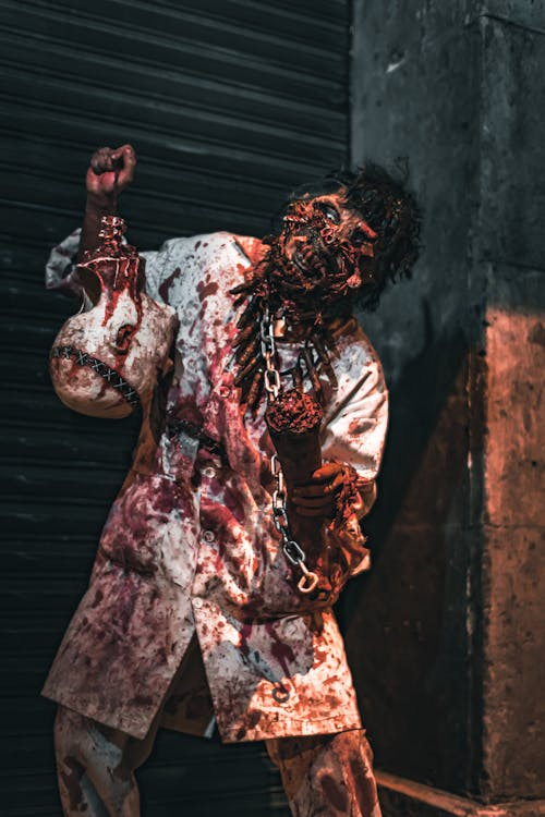 FX makeup of a man dressed as a blood-covered zombie