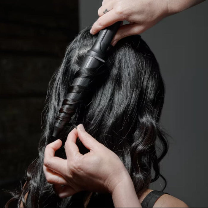 GHD Curve Creative Curl Wand being used to curl hair