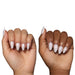 Glamnetic Press-On Nails Silent Night applied on the nails of light and dark skin hands