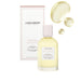 Laura Mercier Aromatic Bath & Body Oil 3.3oz Almond Coconut bottle in front of product box with swatch above and to the right.