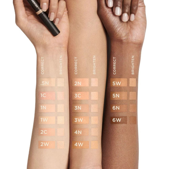 Laura Mercier Secret Camouflage Brighten and Correct Duo swatches on different skin tones light to dark