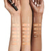 Laura Mercier Secret Camouflage Brighten and Correct Duo swatches on different skin tones light to dark