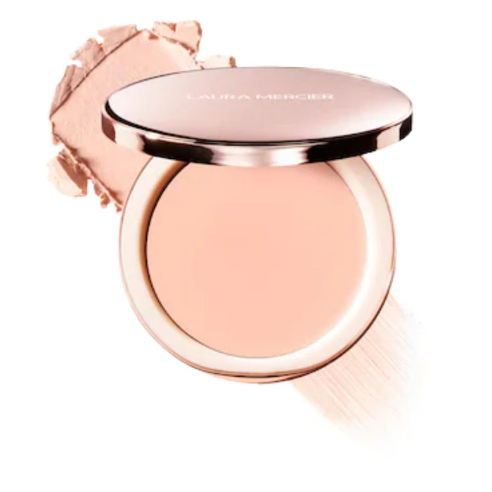 Laura Mercier Tinted Blur Balm Skin Tint 00 with swatch behind open compact