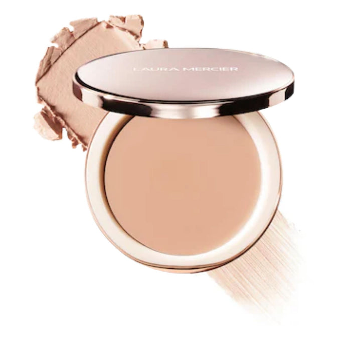 Laura Mercier Tinted Blur Balm Skin Tint 01 with swatch behind open compact