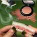Ultra - Matte Chill Powder Blush - One Hit Wonder with green background.