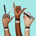 NYX Vivid Matte Liquid Liner Arm Swatches with arms holding products