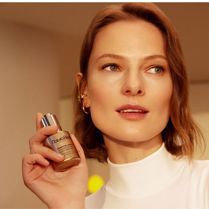 Natura Bisse Essential Shock Intense Retinol Night Renewal held by female model