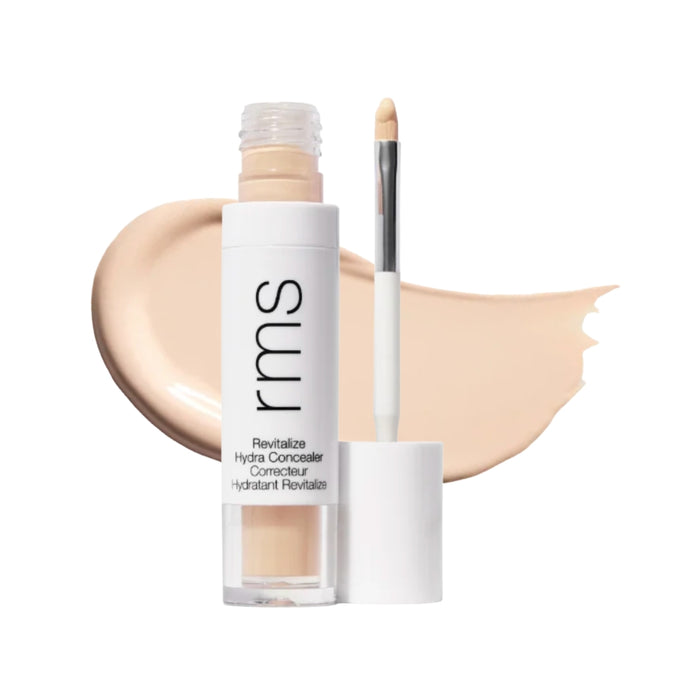 RMS Revitalize Hydra Concealer with swatch behind product against white background.