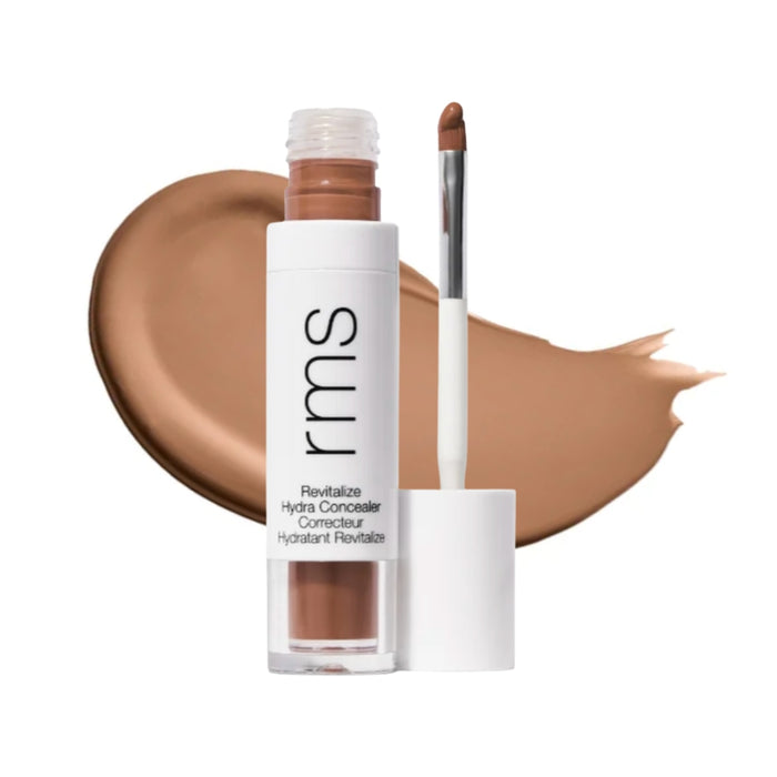RMS Revitalize Hydra Concealer with swatch behind product against white background.