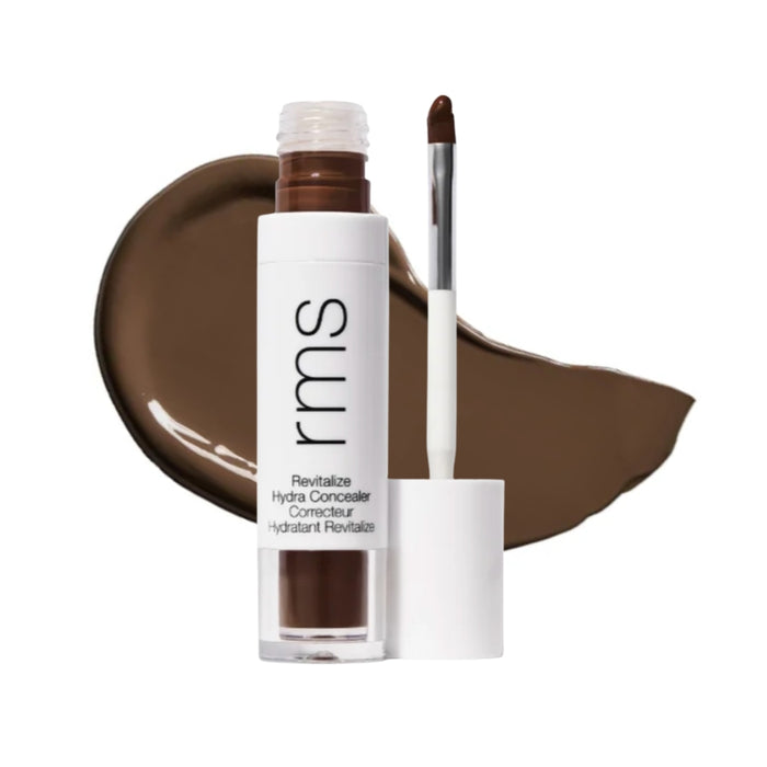 RMS Revitalize Hydra Concealer with swatch behind product against white background.