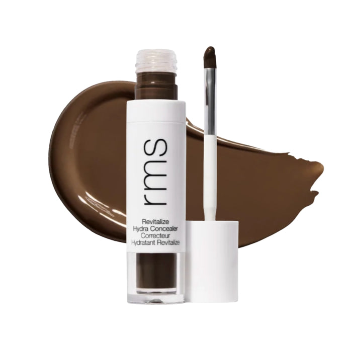 RMS Revitalize Hydra Concealer with swatch behind product against white background.