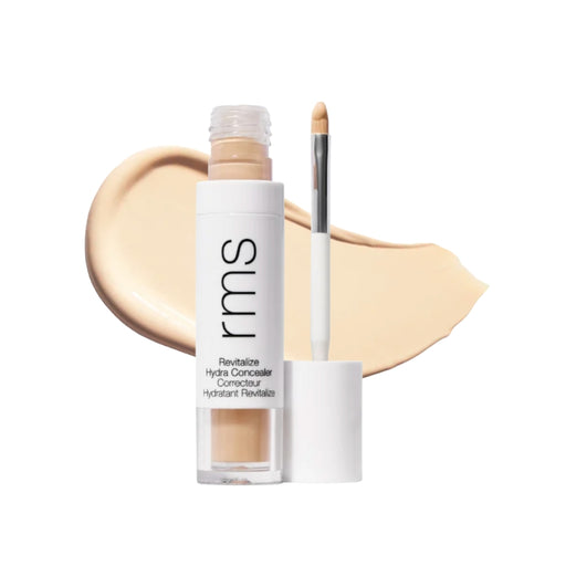 RMS Revitalize Hydra Concealer with swatch behind product against white background
