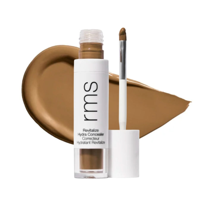 RMS Revitalize Hydra Concealer with swatch behind product against white background.