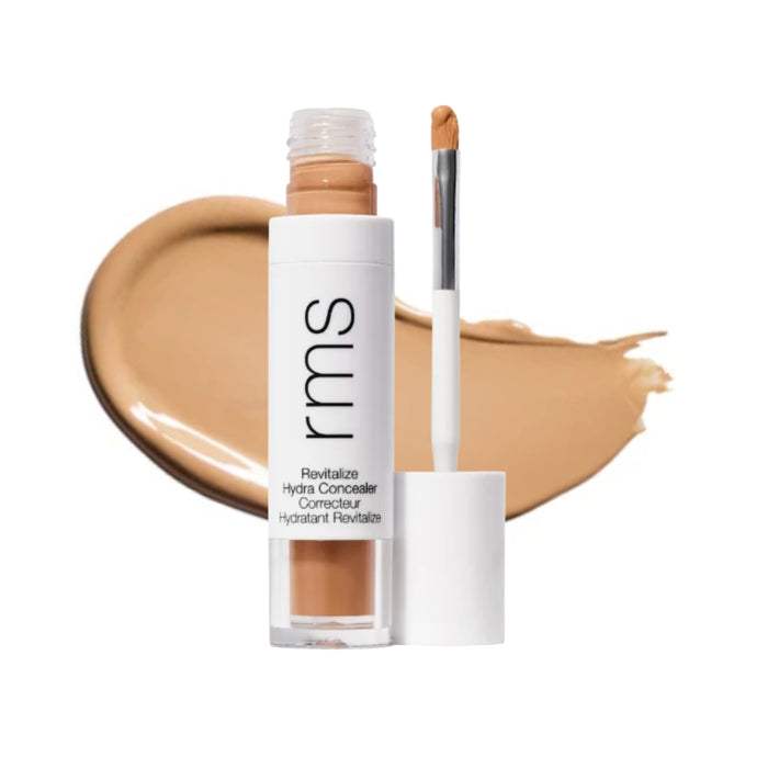 RMS Revitalize Hydra Concealer with swatch behind product against white background.