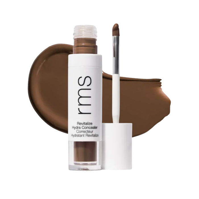RMS Revitalize Hydra Concealer with swatch behind product against white background.
