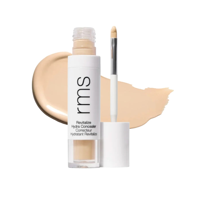RMS Revitalize Hydra Concealer with swatch behind product against white background.