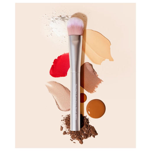 RMS Beauty Skin2Skin Everything Brush stylized with multiple makeup products 