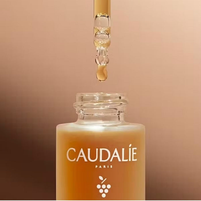Caudalie self-tan sun drops styled close-up 