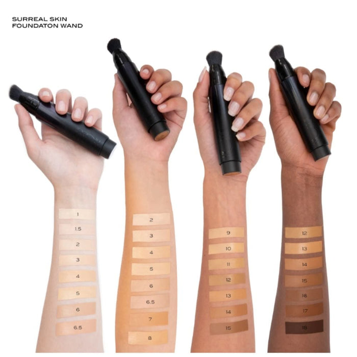 Surratt Surreal Skin Foundation Wand arm swatches on 4 different skin tones holding wands