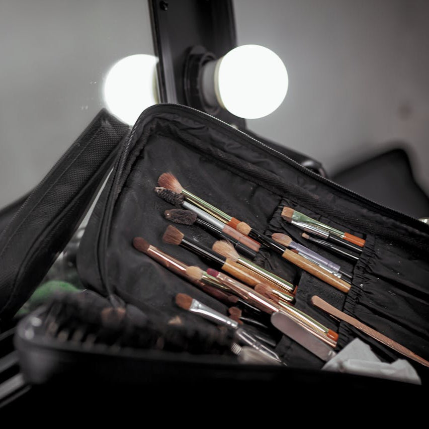 Black makeup pouch with brushes and tools