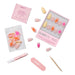 Glamnetic Press-On Nails Sunset Tide kit contents spread across a white background