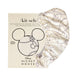 Kitsch Mickey print Satin Wrapped Hair Towel in front of packaging
