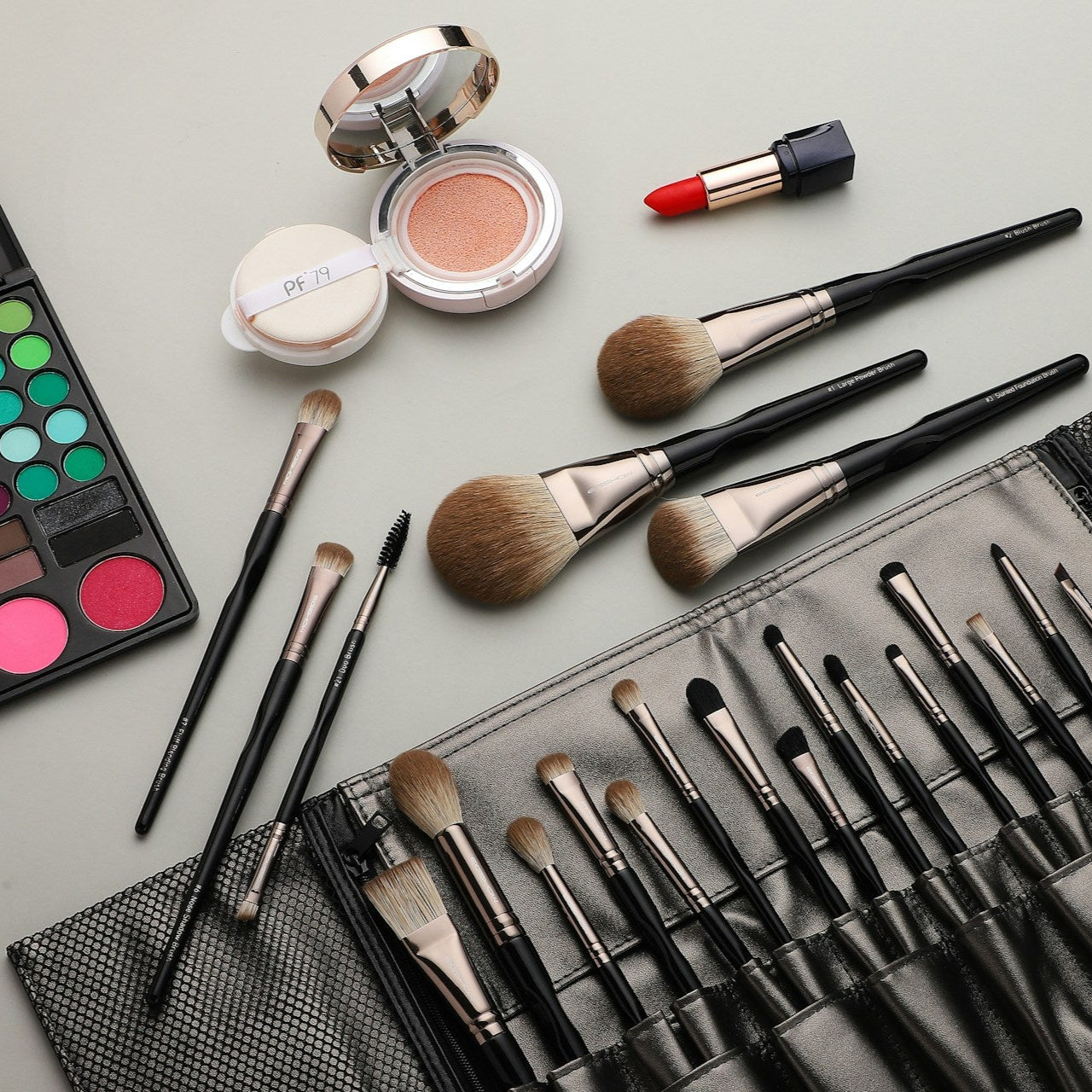 Makeup brushes and powders packed in a professional makeup kit