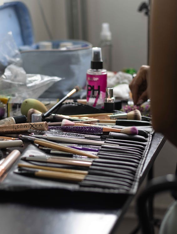 Makeup brushes and tools assembled on a table